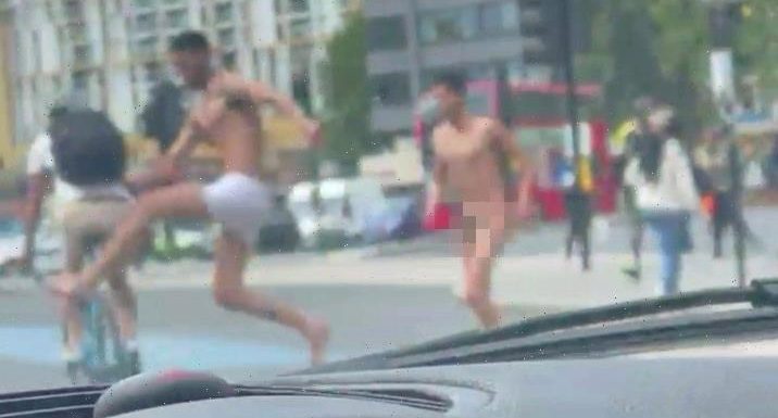 Bizarre moment two naked men attack cyclist & knock him off bike before walking off in nude