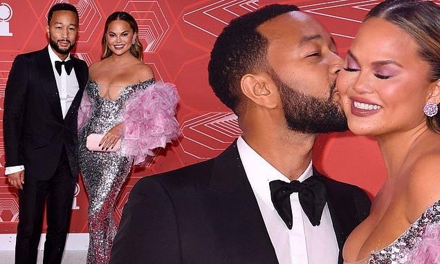 Chrissy Teigen receives a kiss from husband John Legend at Tony Awards