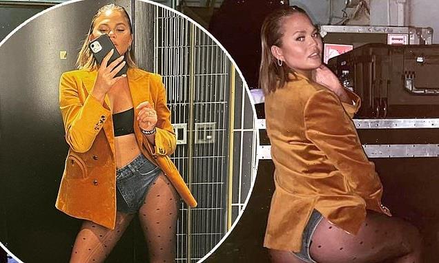 Chrissy Teigen shows off her peachy derriere in a pair of TINY shorts