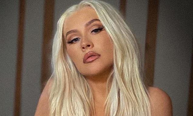 Christina Aguilera, 40, poses before her vanity TOPLESS on Instagram