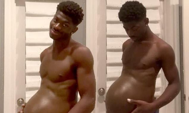 Lil Nas X strokes a fake baby bump as he's 'pregnant' with debut album