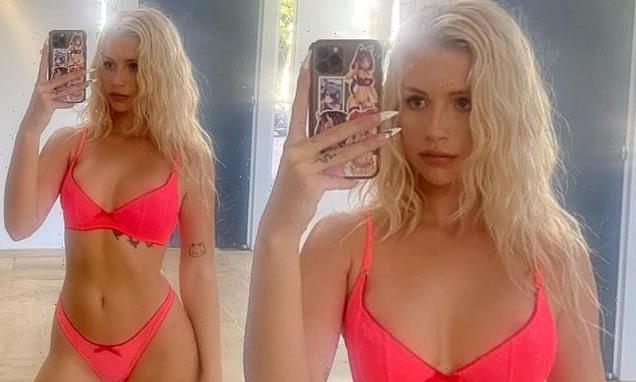 Lottie Moss shows off her tanned physique in a hot pink bikini
