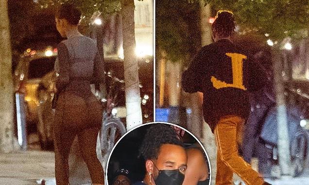 PICTURE EXC: Lewis Hamilton returns to his hotel with a mystery woman