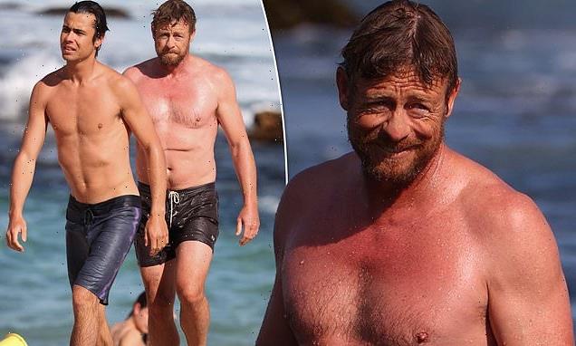 Simon Baker shows off his abs as he relaxes with son at Bronte Beach