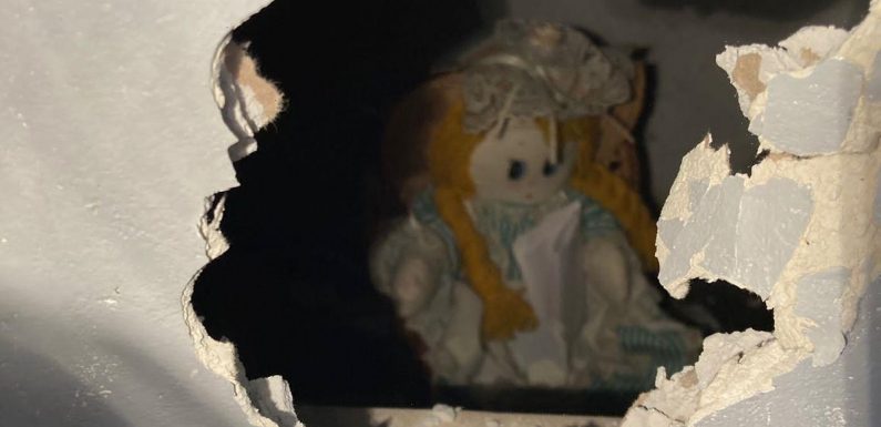 Teacher told to move out as creepy doll ‘who killed owners’ found sealed in wall