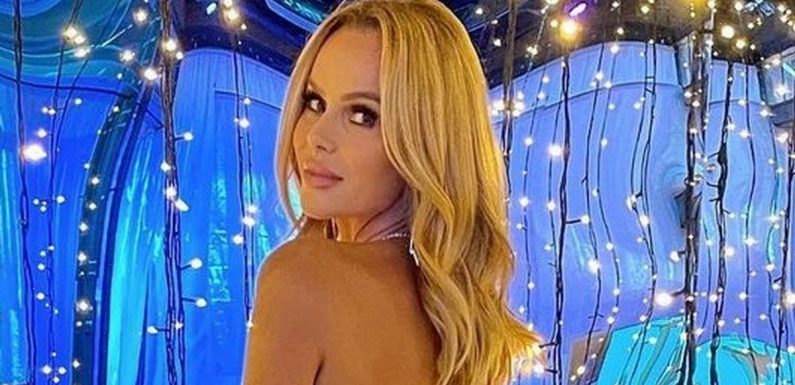 Amanda Holden strips off for luxury back massage after night in lavish hotel