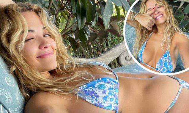 Rita Ora showcases her incredible figure in a blue floral bikini