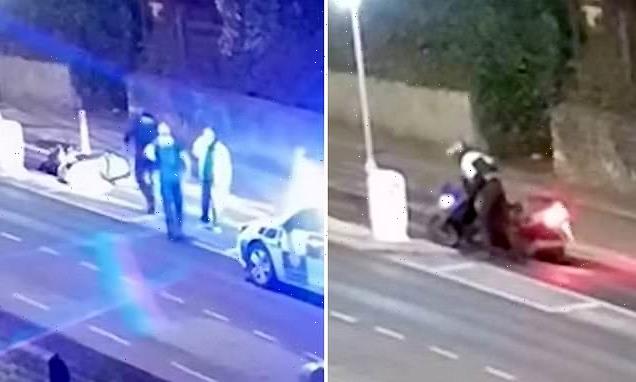 Teenager is caught on CCTV carefully staging a motorbike crash