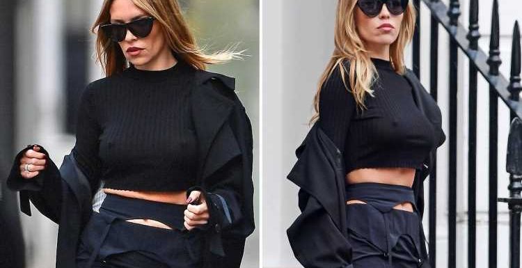 Abbey Clancy flashes a glimpse of her toned tum on modelling shoot in London