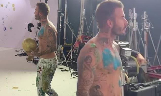 David Beckham goes shirtless to create artwork using football skills