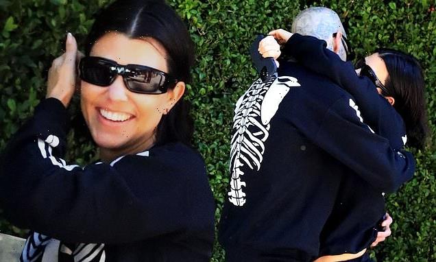 Kourtney Kardashian and fiancé Travis Barker share a kiss in LA