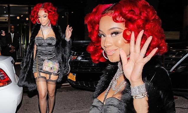 Saweetie shows off in a satin dress and fur shawl as she heads to SNL