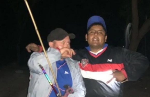 Terrifying veiled ghostly figure spotted lurking behind fishermen in scary snap