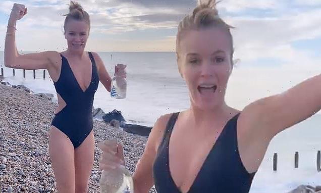 Amanda Holden shows off her toned frame in a busty black swimsuit