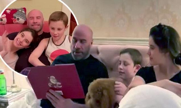 John Travolta reads to children Ella and Benjamin in bed on Christmas