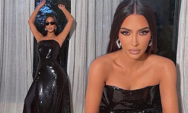 Kim Kardashian rocks a black sequined gown for a photo shoot at home