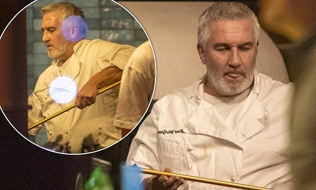 Paul Hollywood, 55, works up a sweat during night shift at pub
