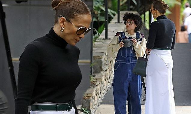 Jennifer Lopez looks chic in a white skirt for lunch with her twins