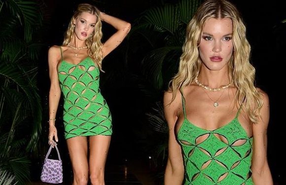 Joy Corrigan shows off her figure in cut-out green dress in Cabo
