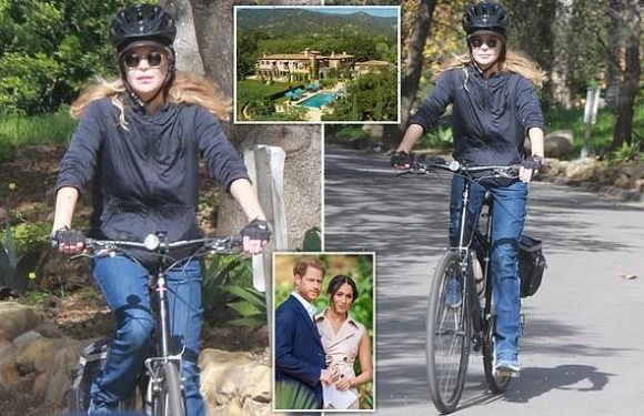 Meg Ryan rides her bike on the Sussexes' private road