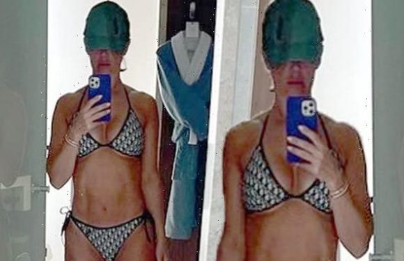 Rebekah Vardy flaunts rock-hard abs as she slips into a chic bikini
