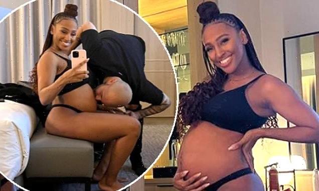 'Ate and popped': Pregnant Alexandra Burke cradles her baby bump