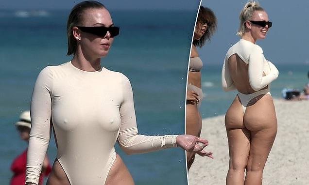 Bianca Elouise flaunts curvy figure in a perilously high-cut swimsuit