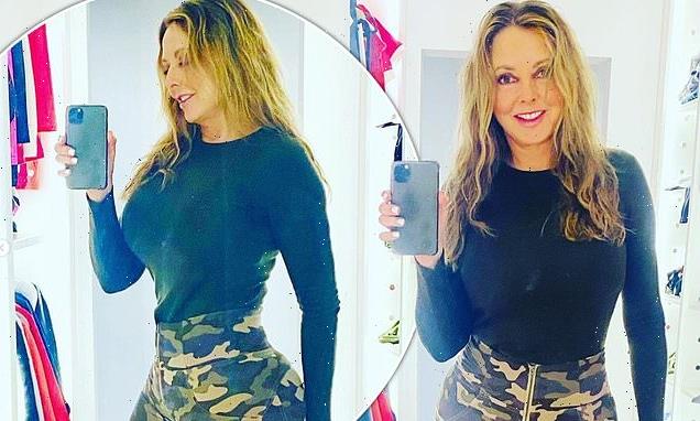 Carol Vorderman, 61, shows off her figure in camouflage trousers