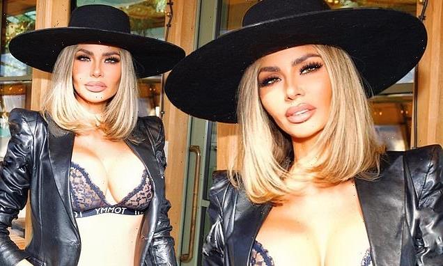 Chloe Sims squeezes her eye-popping assets into a black lace bra