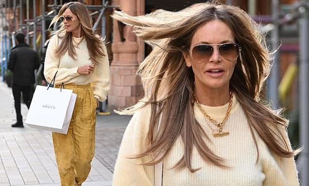 Elle Macpherson, 57, dons a cream knitted sweater and mustard trousers