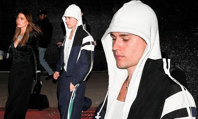 Justin and Hailey Bieber look downcast as they attend Drake concert