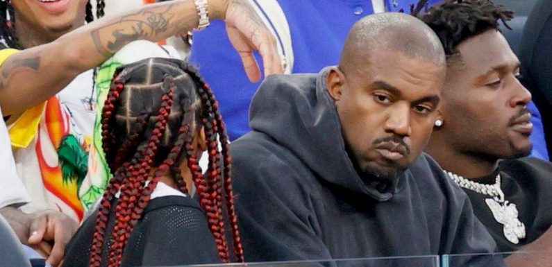 Kanye West looks bored with North and Saint at Super Bowl amid Kim Kardashian feud