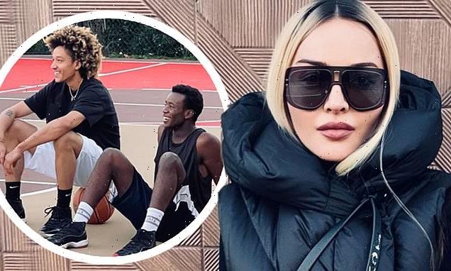 Madonna cheers on her toyboy and her son as they play basketball