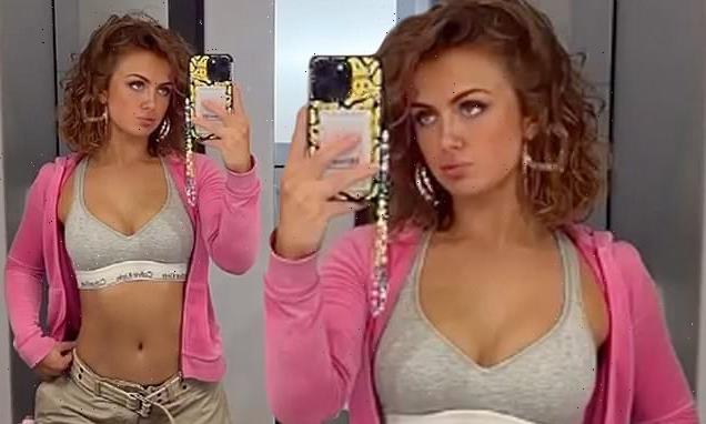 Maisie Smith flashes her toned abs in a light grey Clavin Klein bralet