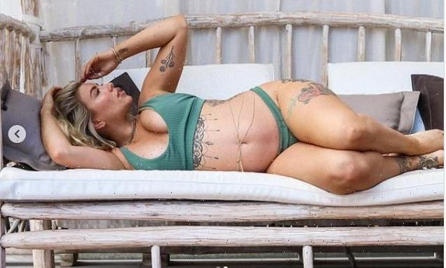 Pregnant Olivia Bowen shows off her blossoming bump in green bikini