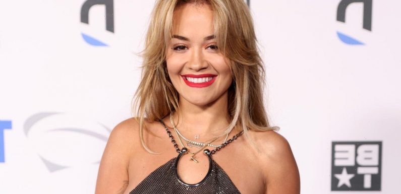 Rita Ora shows off extensive back tattoos as she goes braless in backless top