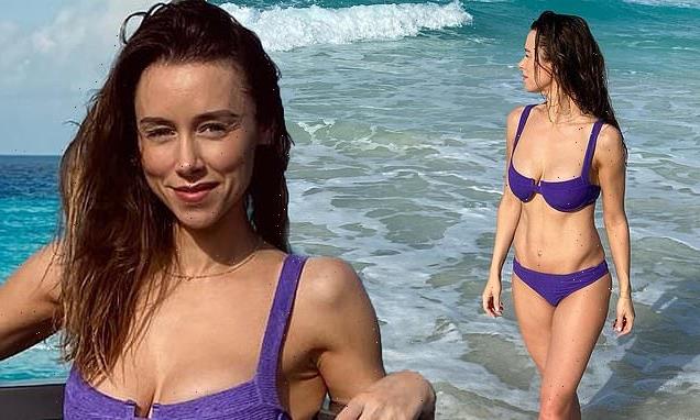 Una Healy flaunts her washboard abs in a purple bikini in Mexico