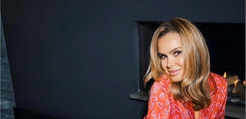 Amanda Holden shows off toned figure in crop top and slinky skirt for glam snap