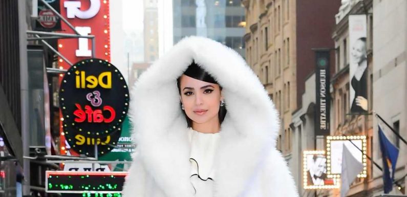 Disney star Sofia Carson cuddles up in enormous snowy white hooded coat, plus more stars in statement outerwear
