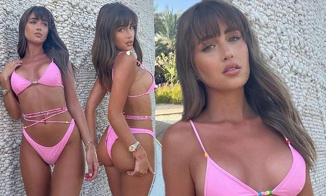 Georgia Steel sizzles in a skimpy pink bikini