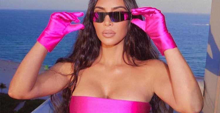 Kim Kardashian shows off tummy in just a bra & skintight pink pants amid rumors she's PREGNANT with Pete Davidson's baby