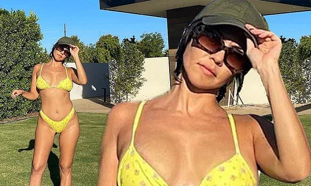 Kourtney Kardashian dons tiny yellow bikini after opening up about IVF