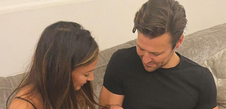 Michelle Keegan and Mark Wright in sweet snap as they cradle newborn nephew