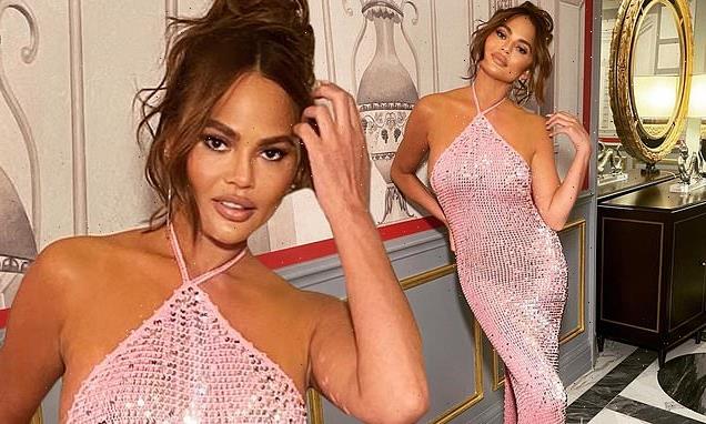 Chrissy Teigen is every inch the glamour girl in a glitzy pink gown