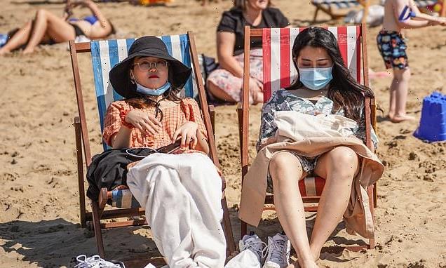 Holidaymakers are 'urged to wear face masks on popular beaches'