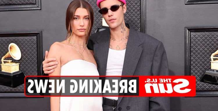 Justin Bieber fans think wife Hailey is PREGNANT after spotting 'baby bump' as she 'hides' tummy in baggy white dress