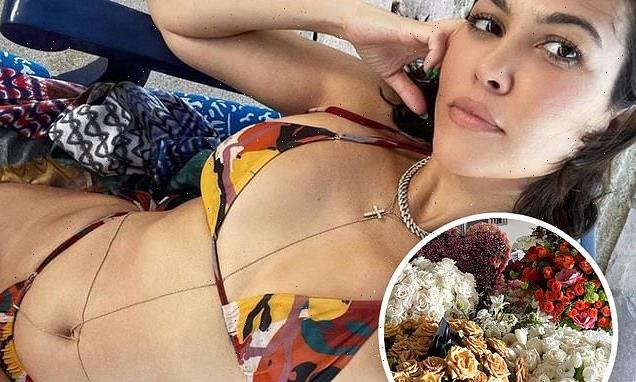 Kourtney Kardashian teases her toned physique in a sexy bikini selfie