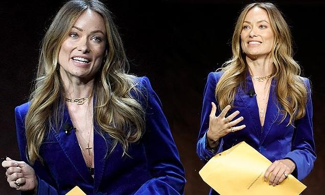 Olivia Wilde gets handed a private and confidential envelope on stage