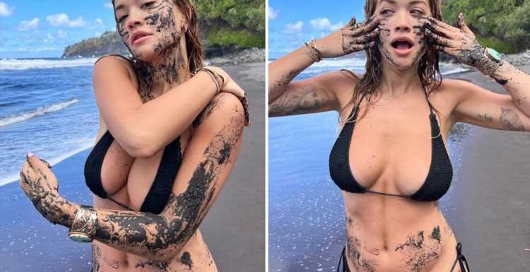 Rita Ora looks incredible in black bikini as she smears mud on her face