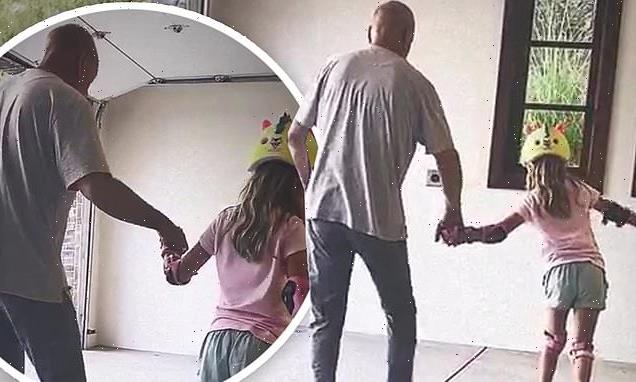 Bruce Willis holds daughter Evelyn's hand as she roller skates